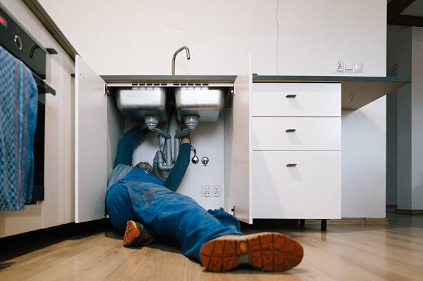 Professional Drain Cleaning technician working in Woodville, MS